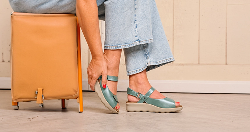 Model with foot pain and sandals